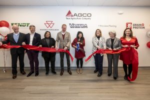 Cutting ribbon at AGCO Grand Re-Opening.