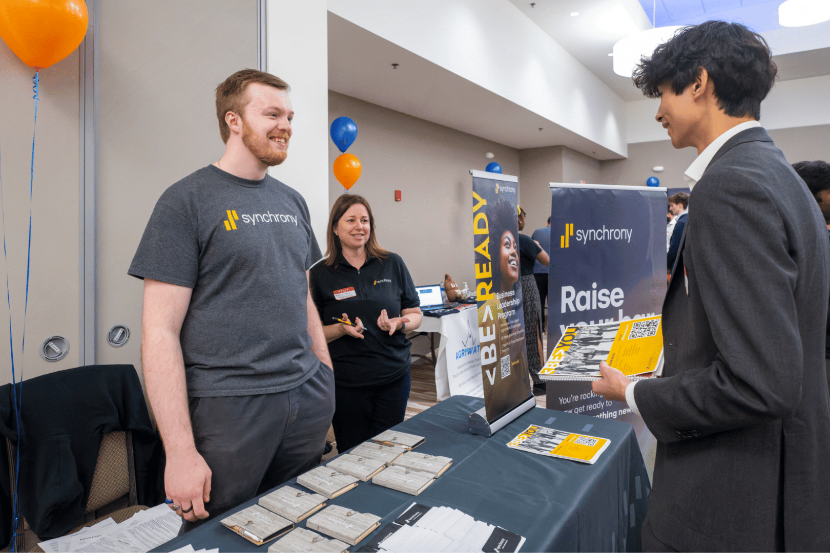 Recruiter from Synchrony and student engaging in conversation