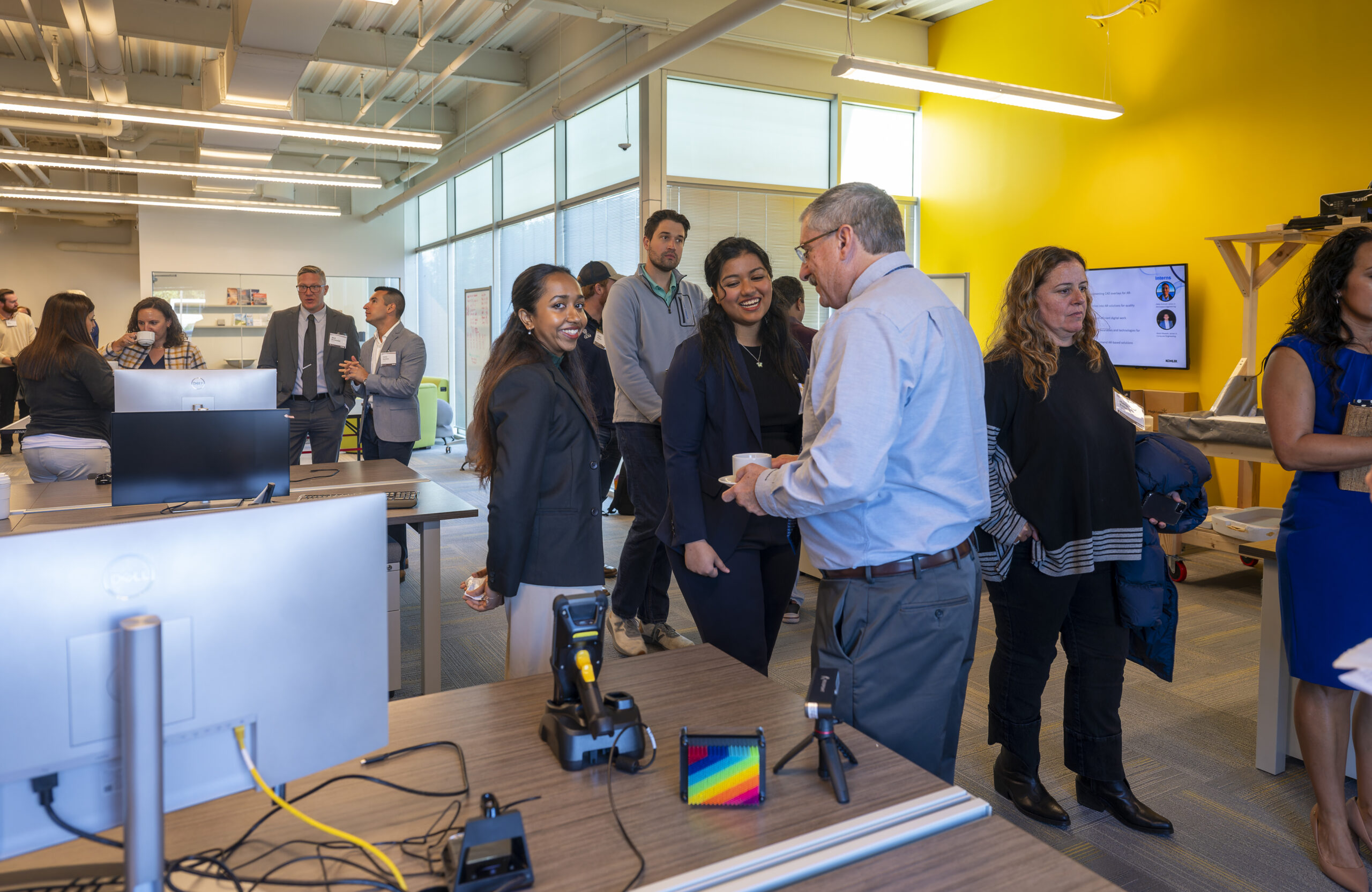 Ceremony attendees enjoy the office space at the Kohler Innovation Center.