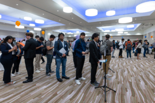 Students waiting in line to speak to employers at the Career Fair