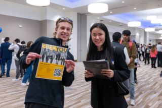 Student smiling with Synchrony ETC intern