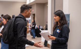 Student speaking with Synchrony ETC recruiter