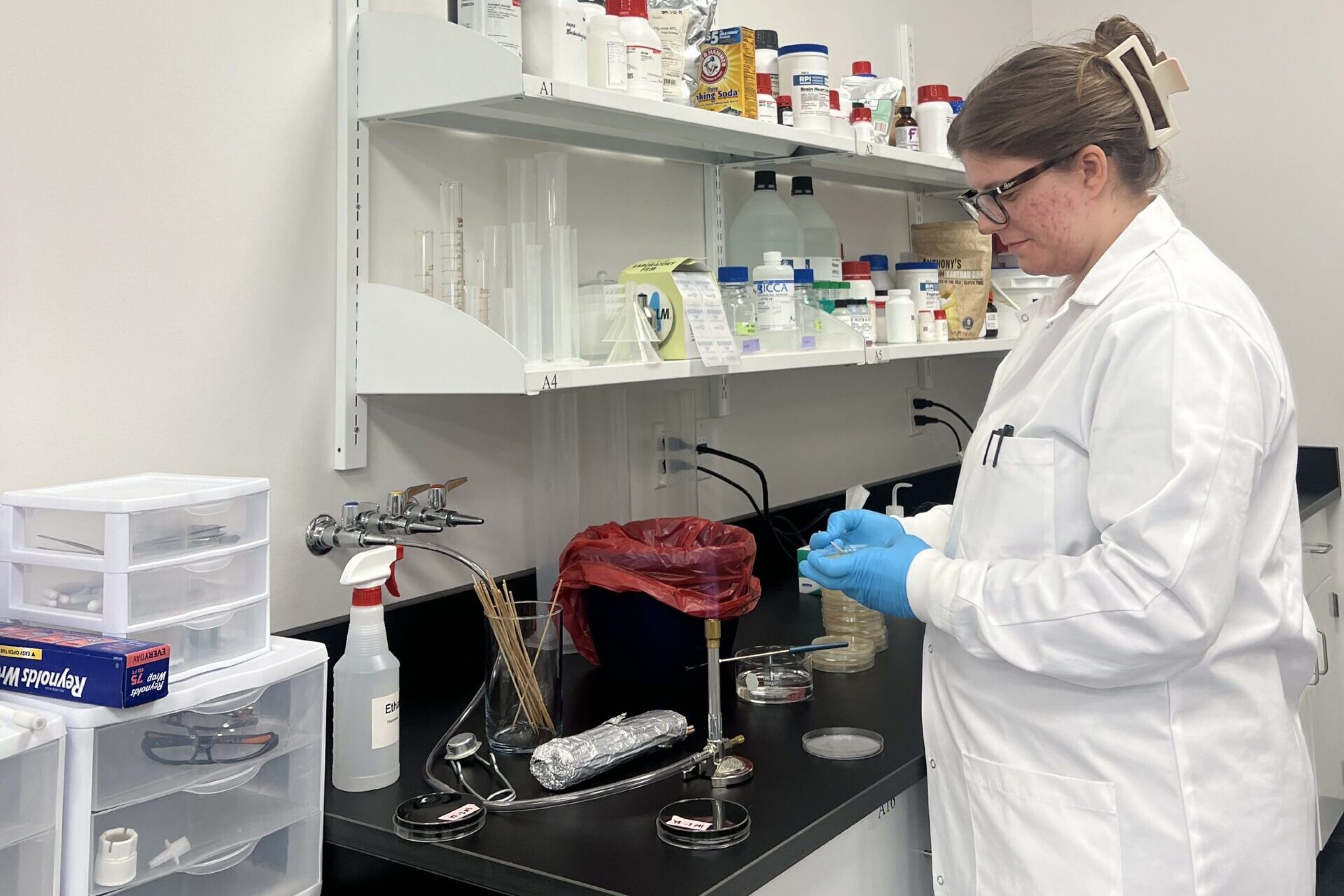 MicroMGX employee Autumn running an experiment